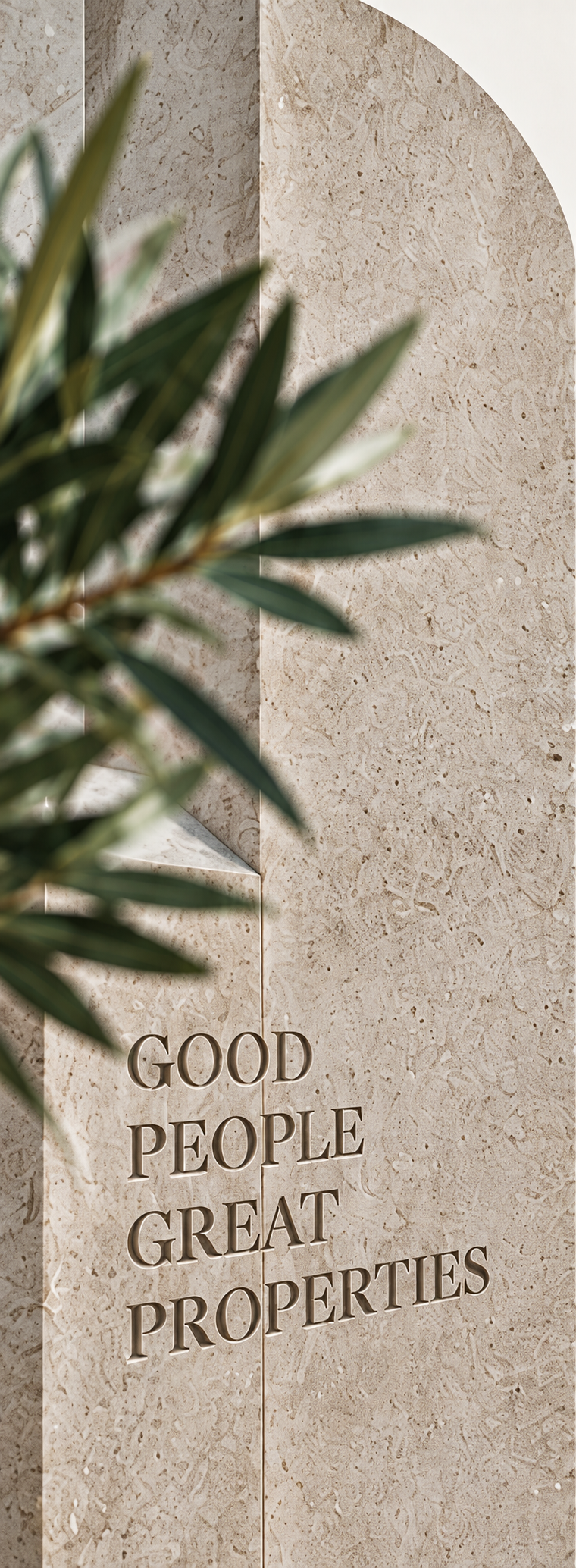 Good People Great Properties, en un muro con ramas de olivo